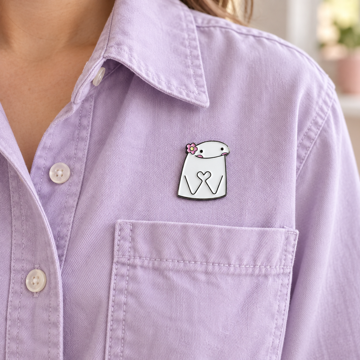 AI-styled wearing view of Flower and Heart Hands Character Pin on pale lavender cotton overshirt being worn by an adult