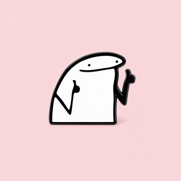 A smiling white doodle character raises both hands in a cheeky gesture. Wear it when a little visual attitude says more than a long explanation on a pale pink background.