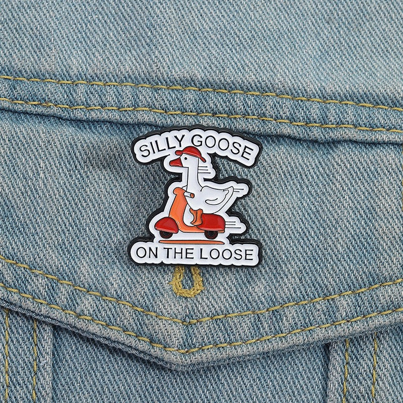 Silly Goose on the Loose Scooter Enamel Pin worn on denim