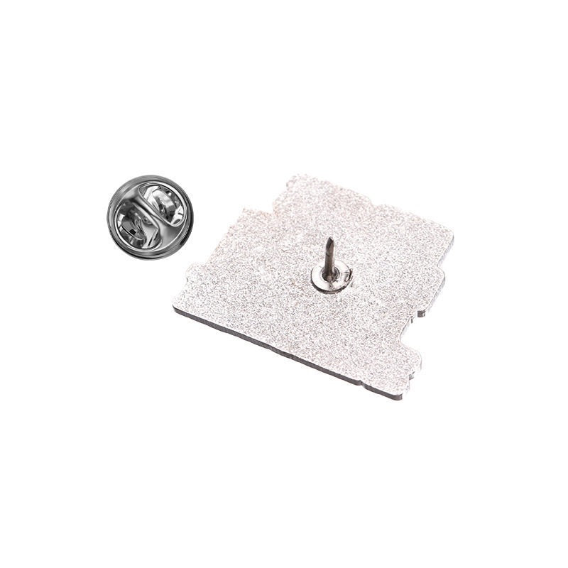 Silver-tone back of spreadsheet enamel pin with butterfly clasp